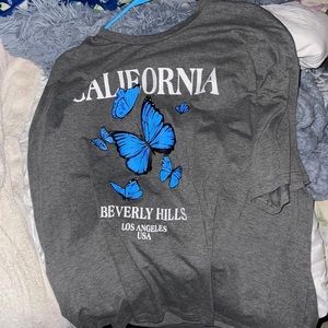 blue butterfly california  gray shirt